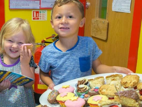 Children at a bake sale for Firefly Cancer Awareness, one of the charities to receive money from the Co-op.