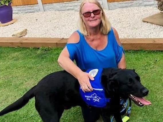 Ann Watson from Doncaster with her epilepsy seizure alert dog Barney