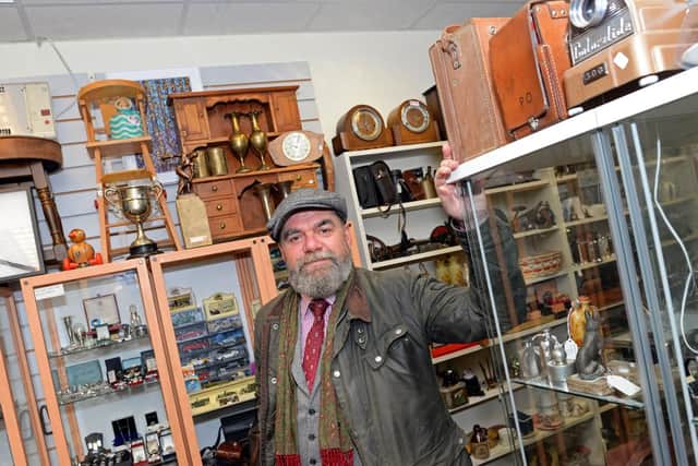 Christian Hughes, pictured in his Antique, Vintage and Retro shop on Bowers Fold, Doncaster. Picture: NDFP-01-12-18-Hughes'd-2