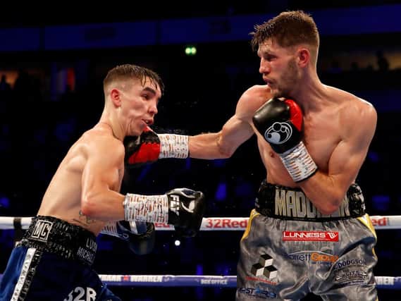 Michael Conlan (left) and Jason Cunningham compete in the WBC Intercontinental Featherweight Championship at Manchester Arena.