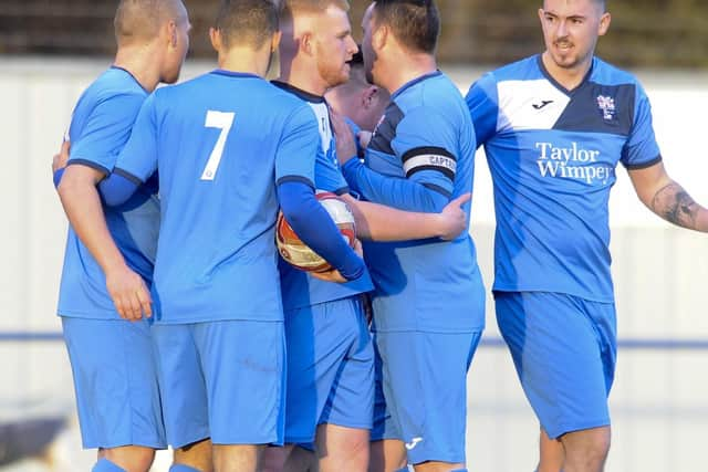 Rossington's Alec Denton is congratulated after scoring.