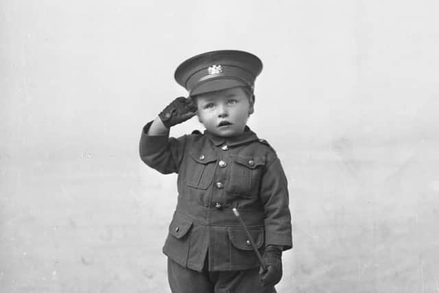 A youngster in his tiny WWI uniform - from The Studio exhibition at Cusworth Hall