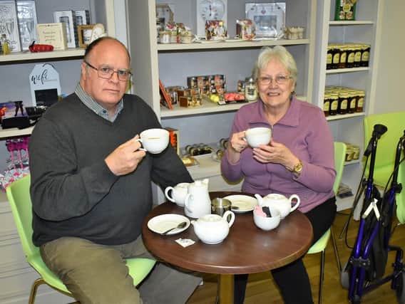 Mike Worthington (left) and Carole Swindells (right) are pictured enjoying a drink in the Lindsey Lodge Hospice Cake Lounge