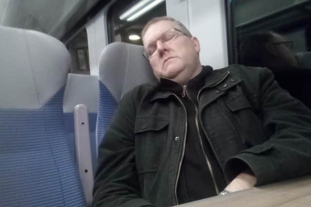 Free Press journalist taking a nap on the train home from work