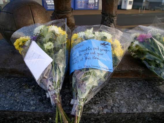 Bunches of flowers outside Cardiff City's football stadium