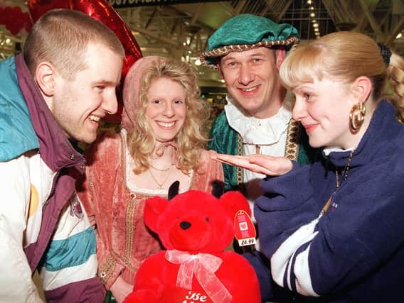 NEWS....10/2/99
Would you Adam and Eve it? Shoppers Shelley Roberts (right), aged 18, and Phil Benson, aged 19, both of Belle Vue, exchange glances over a shopping trolley at the Doncaster Asda store which held a Valentine's night on Wedneday (10/2/99). Looking on are the store's very own "Romeo and Juliet",  Keith Shaw and Gail Parkin.  sat