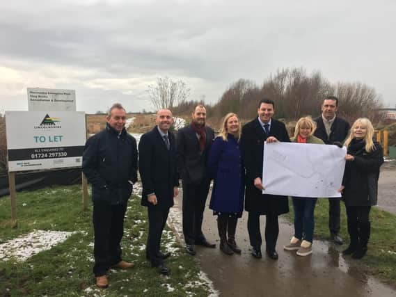 Representatives from the partners involved in the project at the site of the new road on Normanby Enterprise Park
