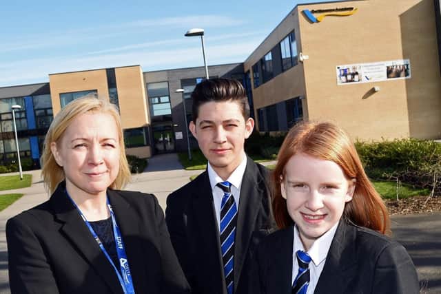 Associate principal Anna Rooney pictured with pupils Connor Fotherby, 15 and Kelsey Callaway, 12, outside De Warenne Academy  (ONLY USE ANNA AS A HEADSHOT)