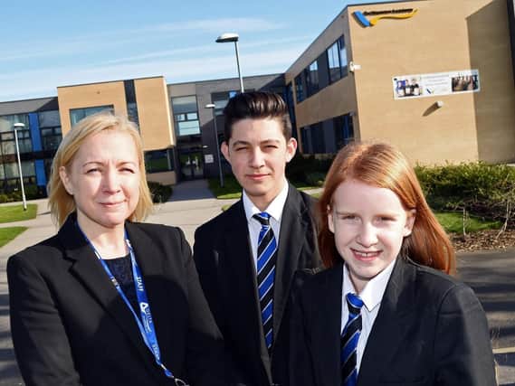 Associate principal Anna Rooney pictured with pupils Connor Fotherby, 15 and Kelsey Callaway, 12, outside De Warenne Academy  (ONLY USE ANNA AS A HEADSHOT)