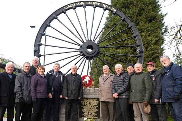 Members of Cadeby Main Colliery Memorial Group, pictured by the Pit Wheel memorial. Picture: NDFP-05-02-19-CadebyColliery-1