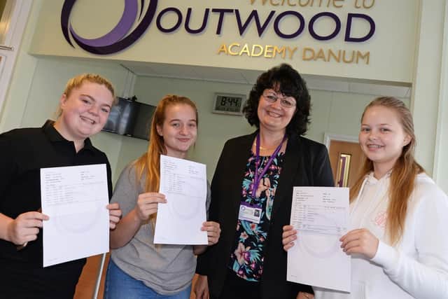 Celebrating their GCSE results with Principal Jayne Gaunt are l-r Lucy Kennedy, 16, of Wheatley, who will be studying A Levels at Outwood Academy Danum, Grace Kemp, 16, of Armthorpe, who will being heading to New College to study A Levels and Kaitlyn Willey, 16, of Intake, who has gained a Hairdressing Apprenticeship. Picture: Marie Caley NDFP-23-08-18-GCSEDanum-1