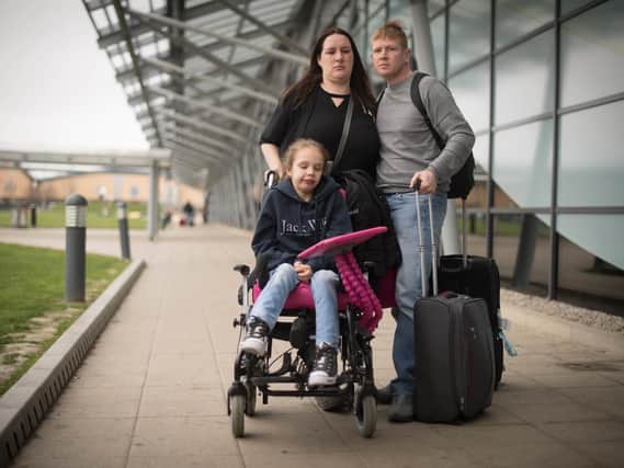 Emma Appleby (left), Lee Moore and their daughter Teagan who has severe epilepsy and was prescribed a cannabis-based medicine but has not been able to access it on the NHS, at London Southend Airport, Essex, after having the medicine they purchased in Amsterdam confiscated by customs officers.