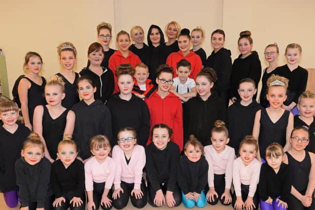 Stepping-Up school of theatre dance, in Dunscroft, is celebrating it's 10th anniversary. Principal Donna Pearce and her assistant Emmie Anderson, pictured with some of the dancers. Picture: NDFP-05-03-19-SteppingUp-1