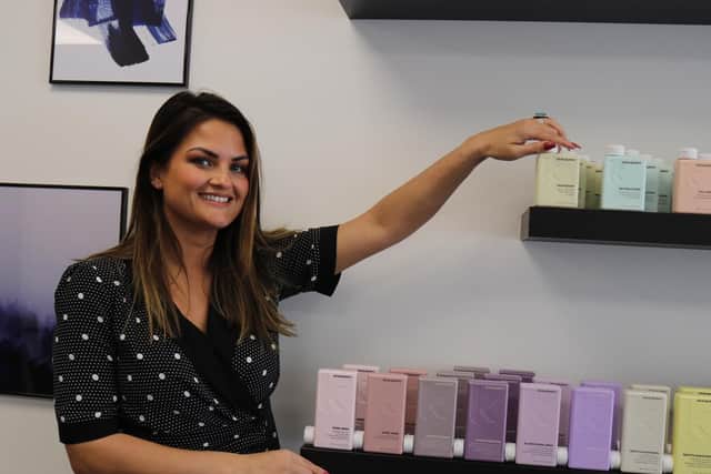 Gemma Thomas, the manager, with Kevin Murphy products.