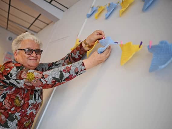 Anne Gosling, Host, pictured hanging up Tour de Yorkshire themed bunting. Picture: NDFP-26-03-19-Renew-3