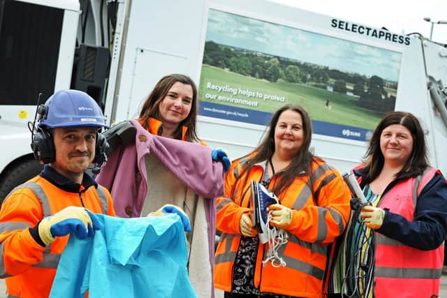 Chris Gallagher, team leader, Nicola Harvey, recycling officer, Victoria Crabtree, contract general manager and Lee Richardson, DMBC waste and recycling manager, pictured, holding a few of the textiles and electrical items that are recycled. Picture: Marie Caley NDFP-16-04-19-SuezGrants-1