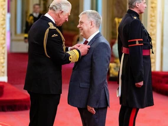 Chief executive of Doncaster and Bassetlaw Teaching Hospitals, Richard Parker, receives his OBE from Prince Charles