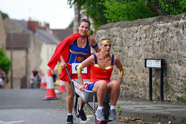 The Open Wheelbarrow race gets underway. Picture: Marie Caley NDFP-04-07-19-BraithwellWheelbarrow-5