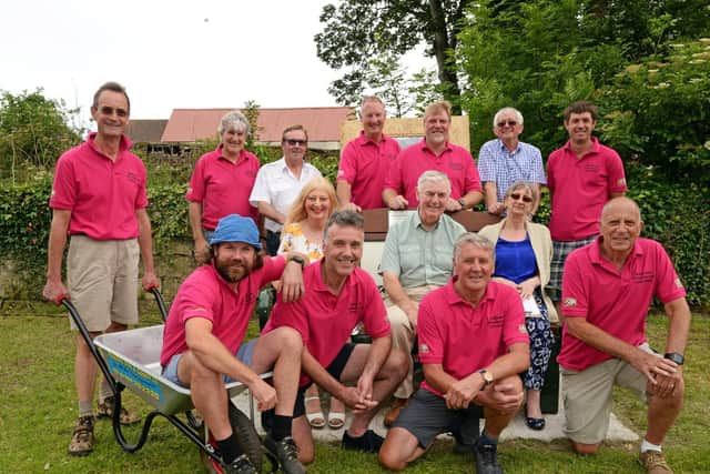 Arnold Pawson (middle), Councillor Martin Greehalgh, his wife Carol, Councillor Nigel Cannings, his wife Margaret, pictured with The Braithwell Wheelbarrow Committee. Picture: Marie Caley NDFP-04-07-19-BraithwellWheelbarrow-1
