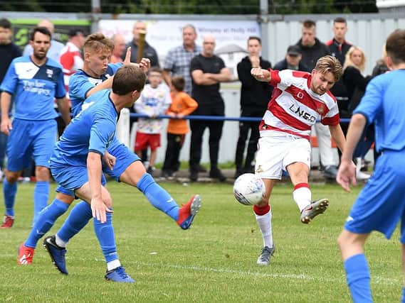 Alfie May scores the opening goal for Rovers at Rossington. Picture: Andrew Roe