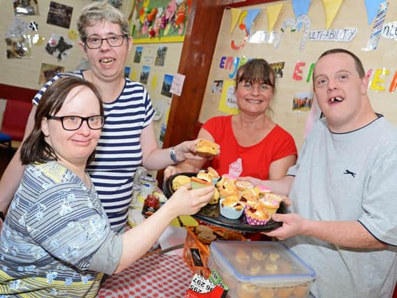 Cara Welch, Amanda Hannan, Fiona Gleadell, outreach worker and Ian Coates, pictured on the Cake Stall. Picture: Marie Caley NDFP-13-08-19-SmileFundraiser-1