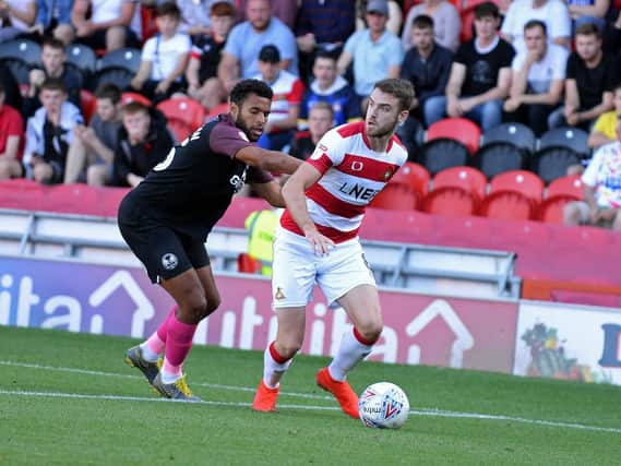 Ben Whiteman gets away from Peterborough's Nathan Thompson. Picture: Marie Caley