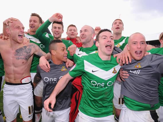 Doncaster Rovers celebrate winning the League One title in April 2013