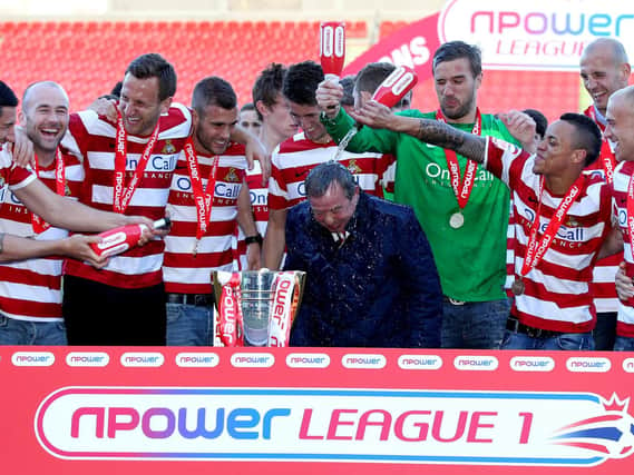 Doncaster Rovers celebrate winning the League One title in 2013