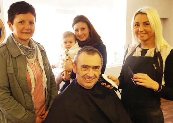 At Rachael's Room Barbers Shop in Crowle are ride out organiser Helen Thompson, coordinator Lucy Christian with Annabella, shop owner Rachael Thompson and Pete Walker. (Buy this photo E2154TS) Picture: Tony Saxton