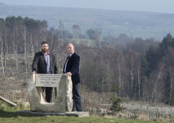 Newman Booth from Yorkshire Water (left) and Ian Hope from the British Dam Society (right) at the new memorial stone commemorating the victims of the 1864 Dale Dyke Dam flood.