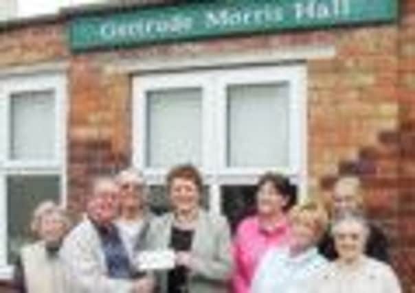 Trustees of Gertrude Morris Hall and were handed a cheque for £300 to kick-start their fund-raising appeal by District Councillor Hazel Brand