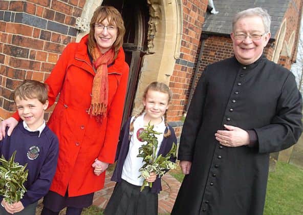 At Wroot Church are Wroot Travis Primary School pupils Aaron Cocker and Gracie Moxon, headteacher Christine Cook and Rev. Ian Walker.  (Buy this photo E2268TS) Picture: Tony Saxton