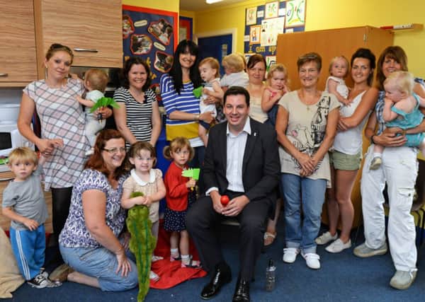 Andrew Percy, MP, pictured with Caroline Byers, Volunteer Imagination Library and parents and their children during the Chatter Book group at Westwoodside primary school. Picture: Marie Caley NEPB Book Chatter MC 1