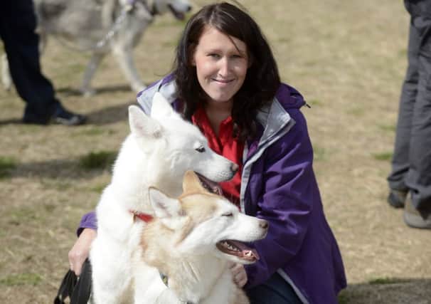 Siberian Husky Aid Rescue & Education (SHARE) together with fellow Husky owners meet and show their dogs at an annual event in Misterton. Founder Clare Dalton with two of her dogs