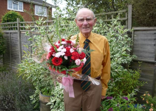 Derrick French, 93,  from Misterton with flowers he received following the 70th liberation celebration in Normandy.