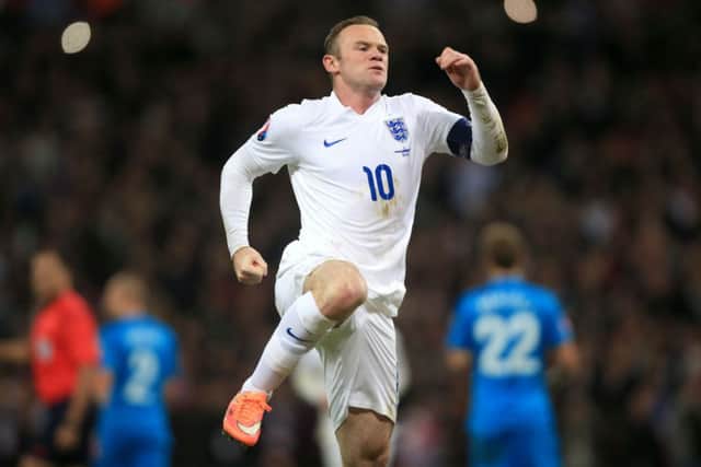 England's Wayne Rooney celebrates scoring his side's first goal of the game from the penalty spot during the UEFA Euro 2016 Group E Qualifying match at Wembley Stadium.