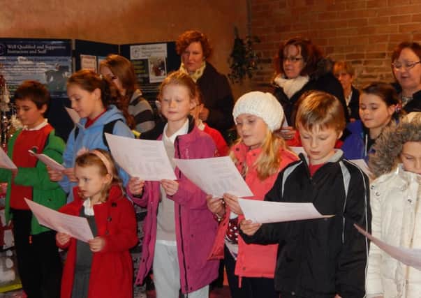 Misterton Primary School children sing carols at The Dovecote Cafe.
