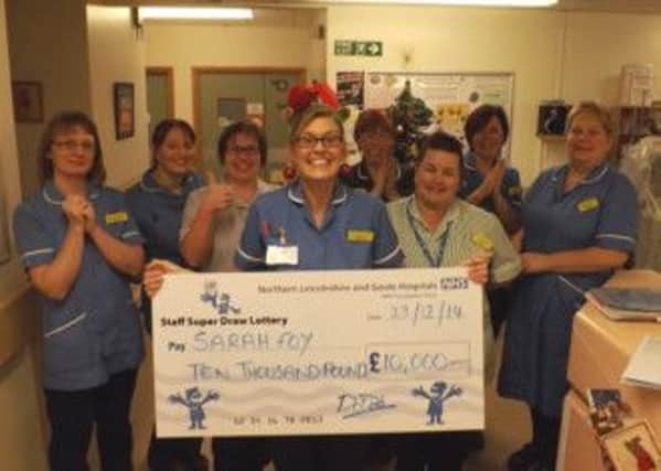 Picture caption: Sarah Foy (centre) is delighted to win £10,000 in Northern Lincolnshire and Goole NHS Foundation Trusts annual staff SuperDraw lottery. Her colleagues celebrate with her from left to right: Kirsty Fairweather, midwife, Sally Hibbard, midwife, Jacqui Wright, senior healthcare assistant, Sarah Foy, Linda Keech, central delivery suite coordinator, Laura McBride, ward clerk, Sarah Fisher, midwife and Joanne Irvine, midwife.