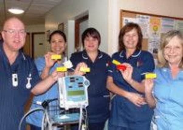 Staff on the stroke unit at Scunthorpe with their yellow name badges and the nurse in charge with her red shift leader badge. (Paul Kirton Watson is on the left)