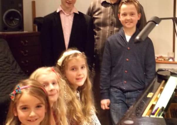 Students at the piano are Megan Mackay, Heather Jenman, Laura Jenman, Dan Griffiths and Max Webster with teacher Dean Headland.