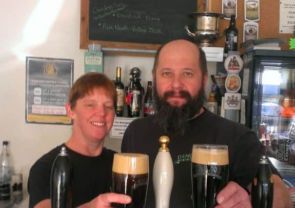 Alison and Ian Blayklock of the Brewery & Tap celebrate their CAMRA award.