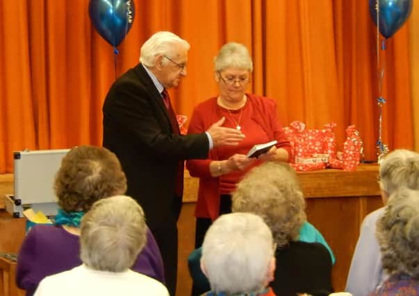 Mistertons senior citizens annual party - pictured is the magician with assistant Hazel Duffner, Chair of the Ladies Group.