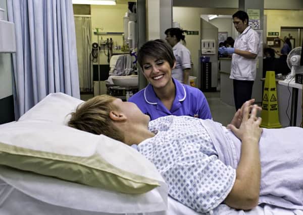 A nurse treats a patient at Scunthorpe A&E.