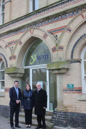 (From left) Andrew Percy MP celebtrates iminent opening of refurbished Crowle Market Hall with town Coun Julie Reed and ward Coun  John Briggs.