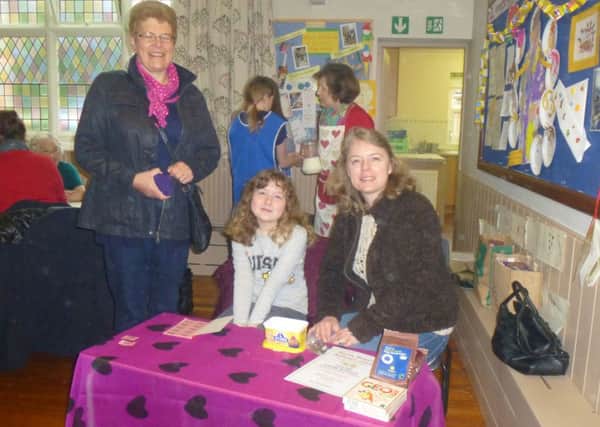 From left, Val Hackney with Poppy and Tracey Janney, who welcomed everyone as they arrived at the special coffee morning with pancakes at Wesley Memorial Methodist Church, Epworth. Phot taken by Louise Howard.