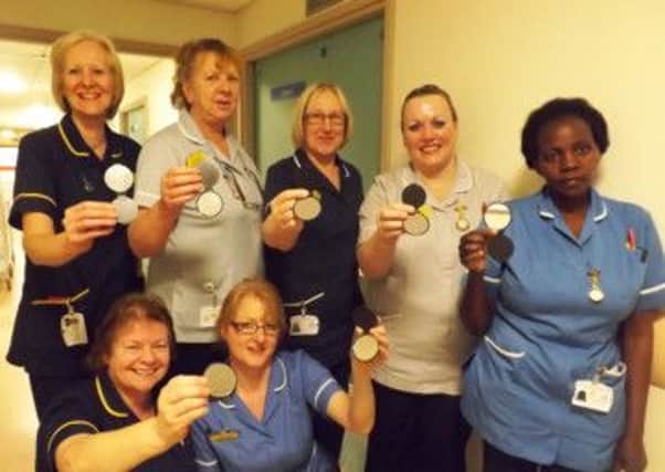 Staff on ward 16 at Scunthorpe hospital with the PUG mirrors, which stands for  pressure ulcer grading mirrors.