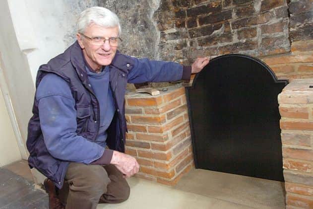 Don Barker, of Don Barker Ltd (York), with the new cast iron fire back he has made at the Old Rectory, Epworth. E2137TS Picture: Tony Saxton
