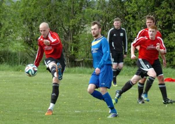 Epworth Town's Gary Moment pumps the ball forward.  Picture: Malcolm Billingham