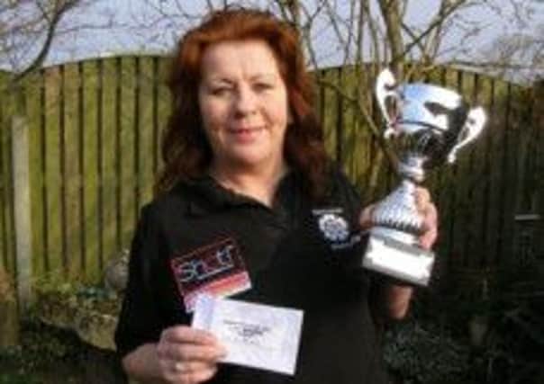 Rachel Brooks with her Yorkshire Ladies championship trophy.