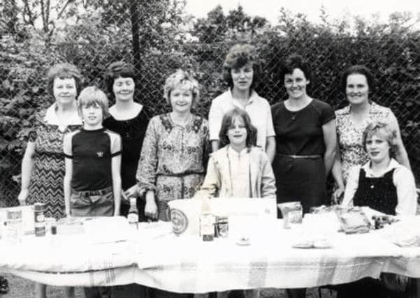 Manning the tombola stall at a community event in days gone by.